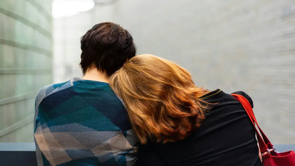 woman resting her head on man